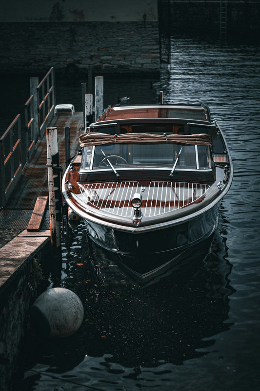 a boat docked at a dock in the water